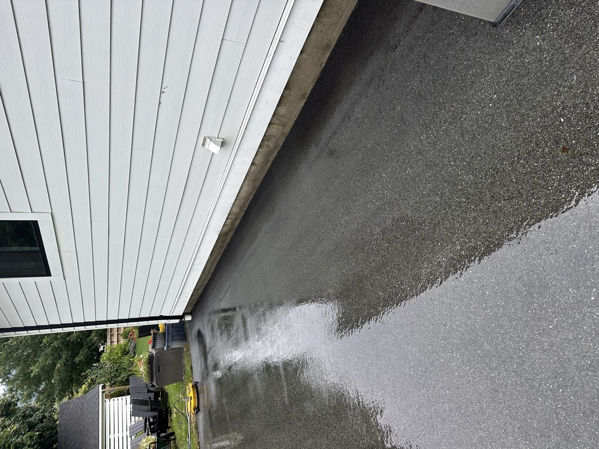 Clean concrete retaining wall after pressure washing in Chilliwack