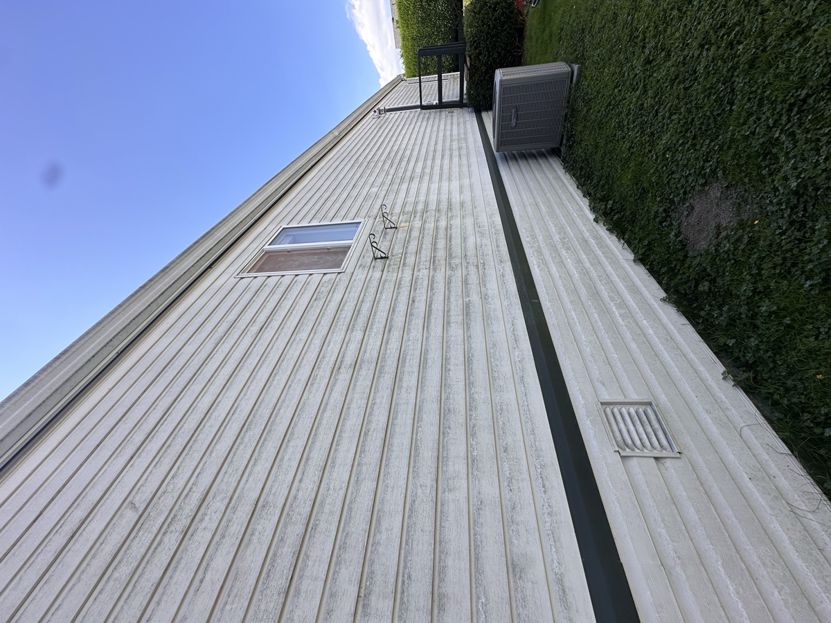 Dirty mobile home siding before professional exterior washing Chilliwack